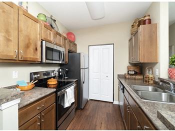 Modern Stainless-Steel Appliances in Kitchen - Fridge, Oven/Stove, Microwave, Dishwasher *